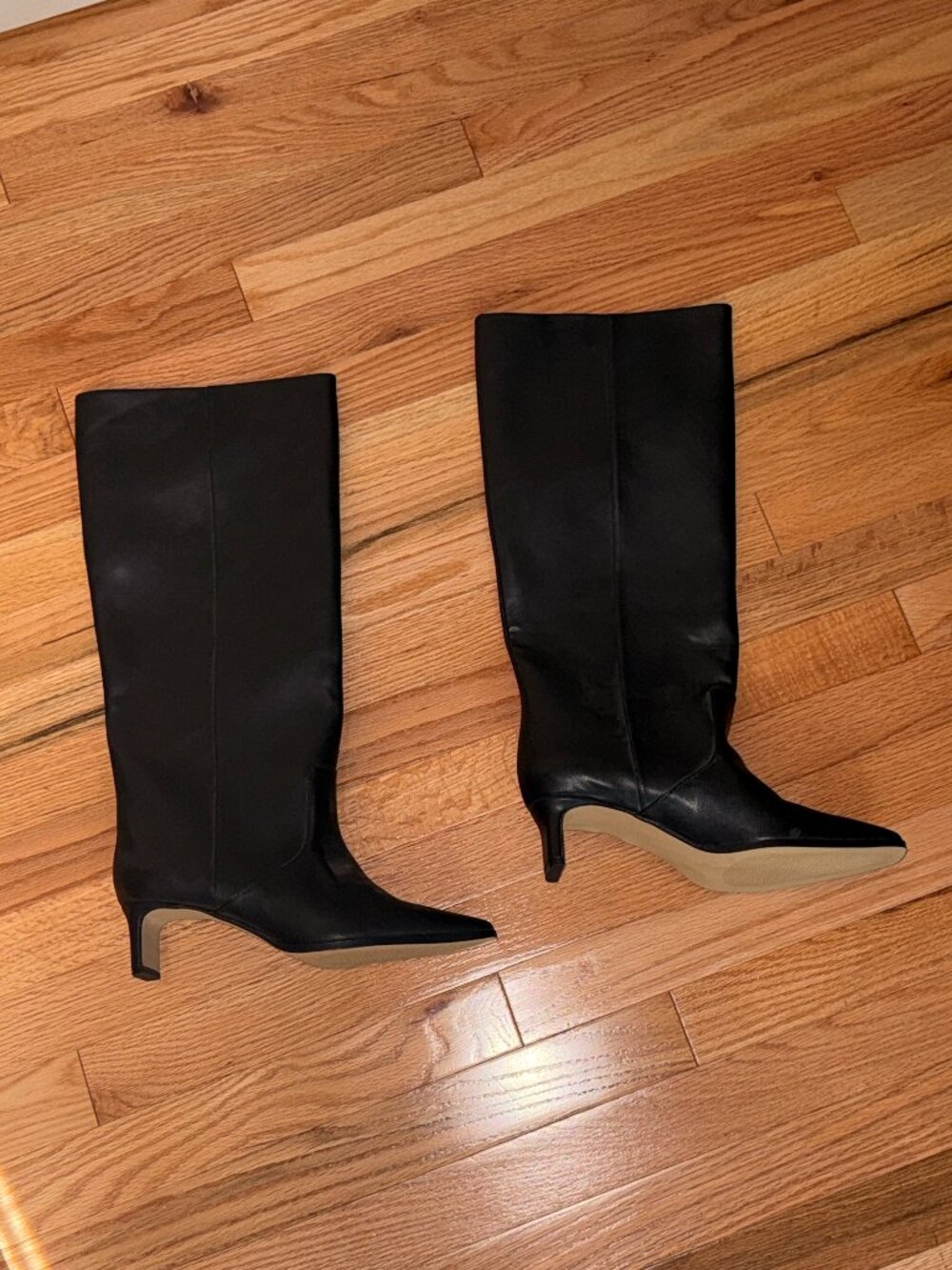 Black leather knee-high boots
